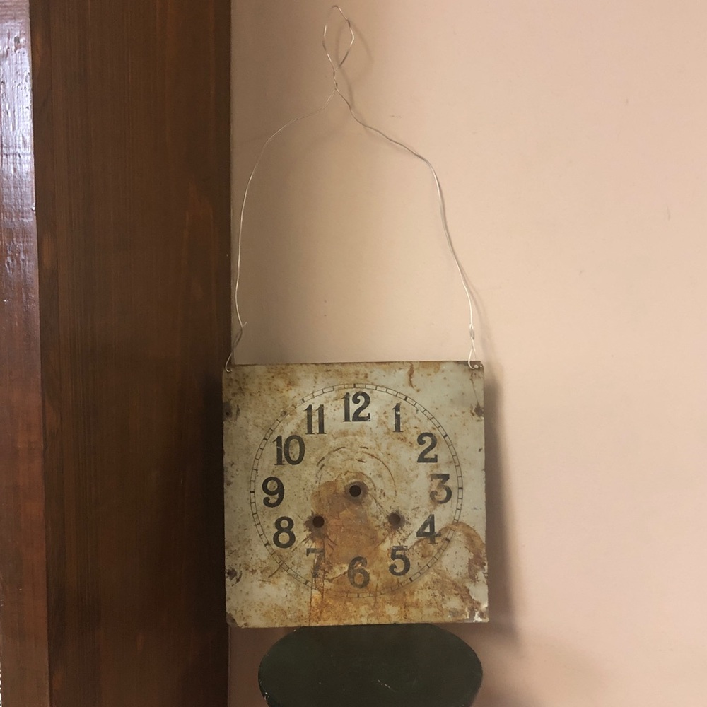 Antique metal clock face made into a unique wall hanging primitive rusty